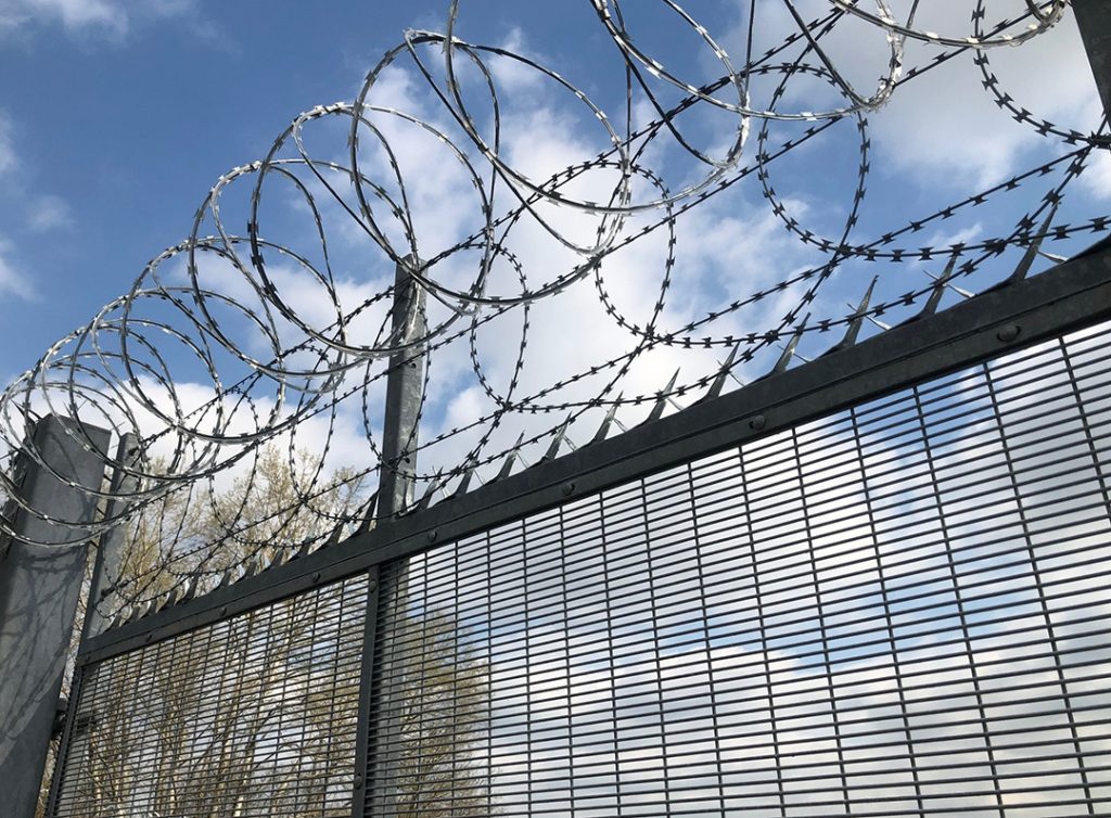 Gate of winsome radical school with chain covered